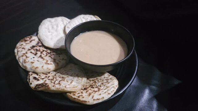 milk and cookies,Serabi or Surabi traditional Indonesian pancake served with palm sugar sauce,made from rice flour and coconut milk.Popular for break fasting ,Eid mubarak celebration and ceremony