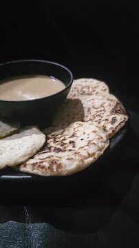 sausage and bread,Serabi or Surabi traditional Indonesian pancake served with palm sugar sauce,made from rice flour and coconut milk.Popular for break fasting ,Eid mubarak celebration and ceremony