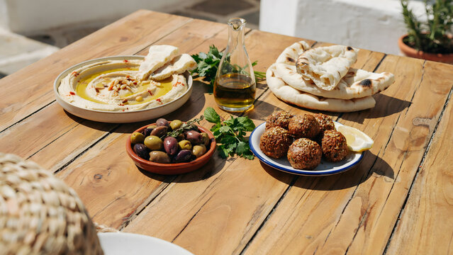 Fresh Mediterranean mezze platter with hummus falafel and pita bread