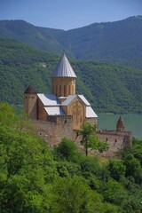 Fototapeta premium Ancient Ananuri fortress with church and scenic lake view in Georgia with copy space