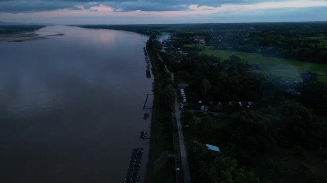 Aerial view landscape of the Mekong river in Nakhon Panom, Thailand.Scene of residential development, waterway transport, and agricultural economy in Thailand.