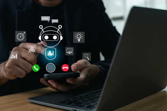 Businessman interacting with an AI chatbot calling interface on a smartphone while working on a laptop, concept of artificial intelligence assistant and customer support