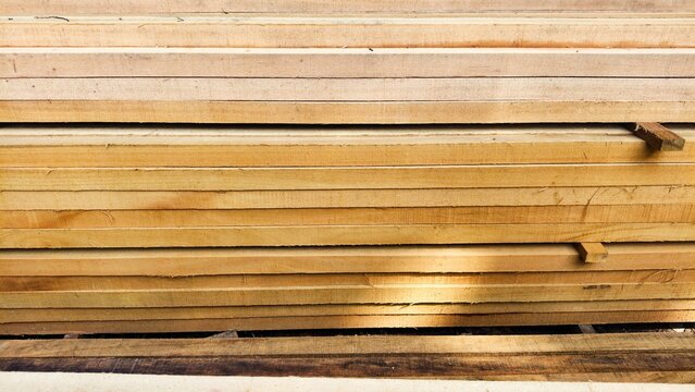 Wood or wood texture 2 inches by two inches and 1 inch by two inches. Wood stack Stacked together Nature cut into pieces for decorating work or Structure. wood material industrial background. 