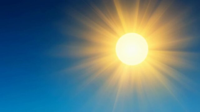 Bright shining sun in clear blue sky with glowing sunlight rays on a sunny day