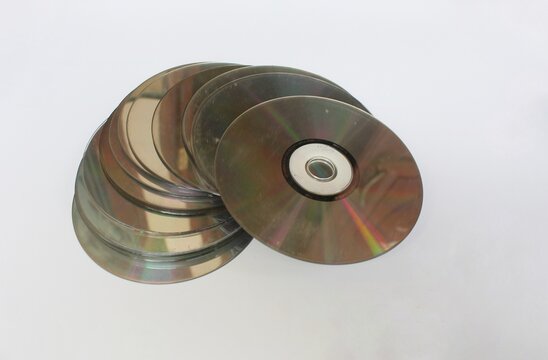 Stack of CD disc isolated in white background, realistic DVD, Blu-ray. Capturing vintage concept.