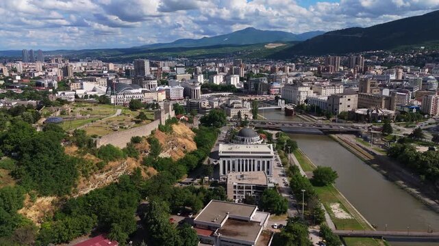 Aerial Dolly Out of Skopje Cityscape with Vardar River and Kale Fortress Macedonia