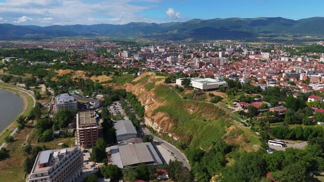 Aerial Dolly Out Skopje Sprawling Cityscape and Mountain Horizon North Macedonia