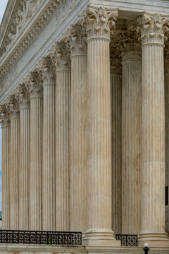 Columns stone repetition symmetry texture. Columns marble architectural pattern. Columns decorative capitals carved detail. Columns classical design.