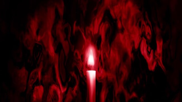 不気味な赤いモヤモヤの中で燃える1本のローソク
