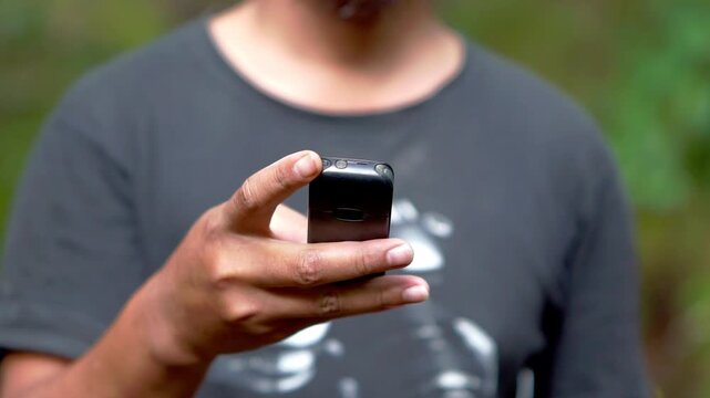 Using a mobile phone in the 2000s. One type of vintage mobile phone.