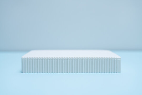 Minimalist Product Display Stand or Podium on Light Blue Background