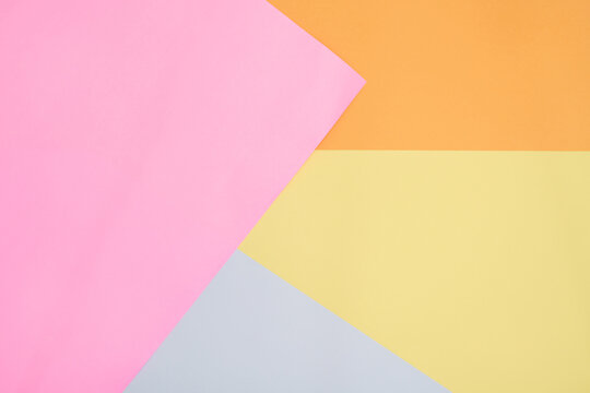 Abstract Background with Colorful Geometric Shapes in Pink, Orange, Yellow, and Grey