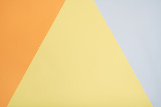 Abstract Background with Geometric Triangles in Orange, Yellow, and Light Grey