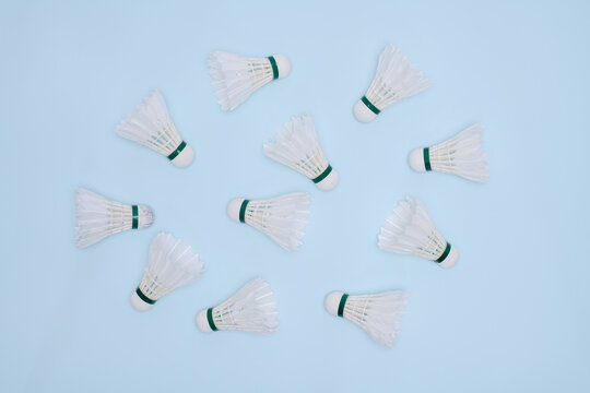 Set of Badminton Shuttlecocks Arranged on a Pastel Blue Background