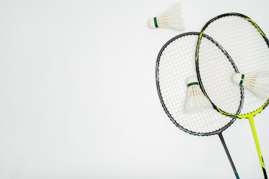 Overhead Shot of Badminton Rackets and Shuttlecocks on White Background