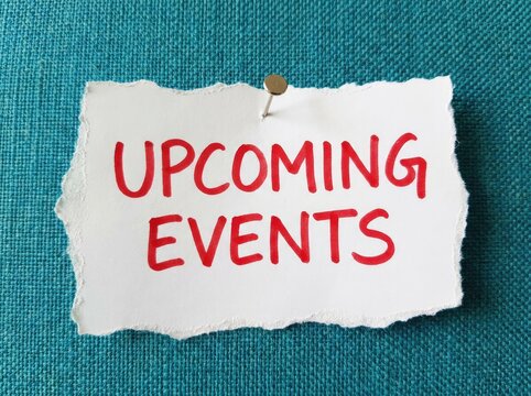 Torn paper note with red handwritten text "UPCOMING EVENTS" pinned to textured blue background, announcement Concept