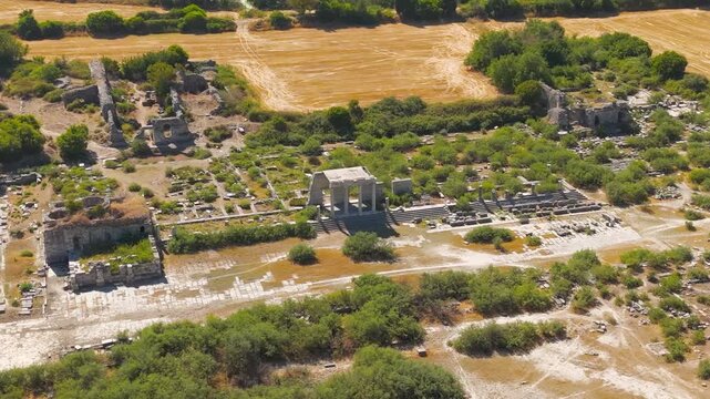 Balat, Turkey. Panoramic aerial drone view of Miletus city center with Delphinion, Bouleuterion and North Agora, ancient stone ruins and Hippodamian grid plan under bright summer sun. Aerial View, Ma