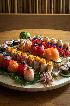 Colorful Assorted Sushi Arranged on Plate. Assorted Sushi Platter on Wooden Table