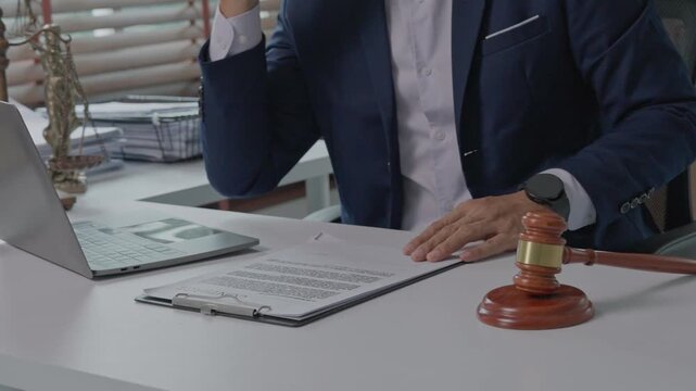 Lawyer reviewing legal contract in office