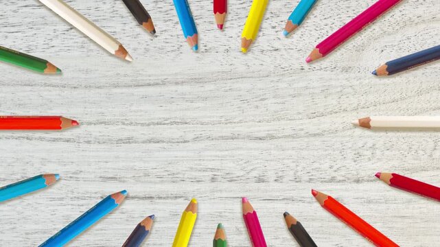 Colored Pencil Radial Frame - wooden background