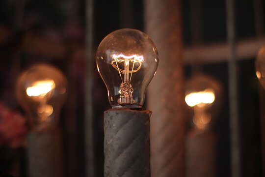 a light bulb on a metal pole