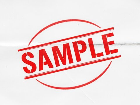 Red sample stamp with bold letters