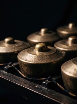 Bronze gamelan bonang boss macro detail on black background