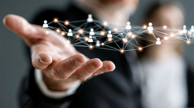 Businessman Hand Holding Glowing Network of People Connections