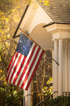 American flag hangs from a porch on Charleston South Carolina