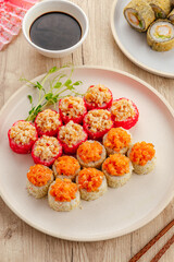 Assorted Japanese sushi rolls on a wooden table © Cavan