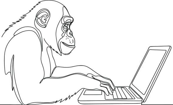 Chimpanzee monkey sitting and typing on a laptop computer