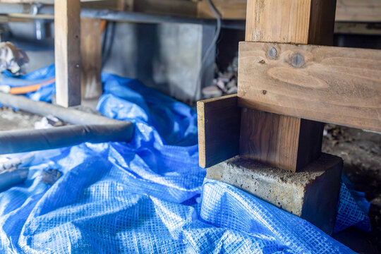 Wooden foundation support under a house during repair work