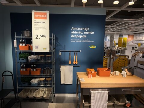 Mallorca, spain, july 09, 2026, ikea retail store interior featuring kitchen storage and organization products, metal shelving, and a wooden island on display