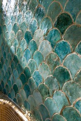 Obraz premium Closeup of hand-crafted emerald zellige tile wall with irregular edges and natural color variations in a contemporary Moroccan bathroom setting