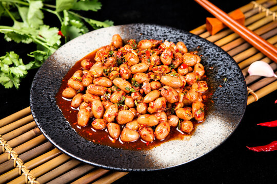Spicy Marinated Peanuts With Chili And Herb On Porcelain Plate