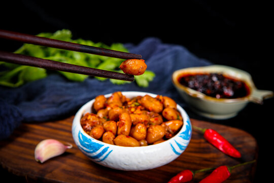 Spicy Marinated Peanuts With Chili And Herb On Porcelain Plate