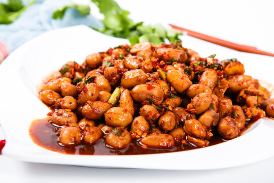 Spicy Marinated Peanuts With Chili And Herb On Porcelain Plate