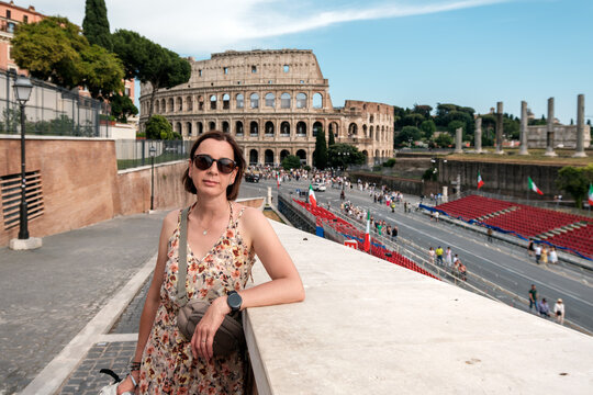 Female Tourist Posing Near the Colosseum with Roman Forum in Rome, Italy on a Sunny Summer Day, Iconic Historic Landmark and Travel Destination