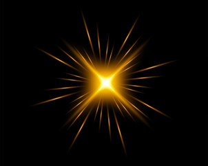 Fototapeta premium Golden glowing starburst with radiant light rays isolated on black background.