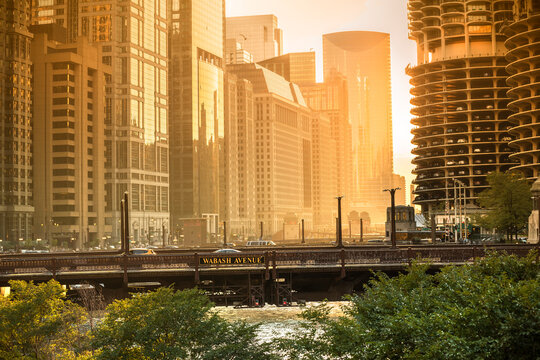 Gold sunset lighting up the Wabash Avenue bridge and Chicago