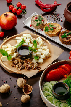 Assorted Georgian appetizers on a wooden table