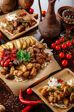 A rustic feast of assorted grilled meats and vegetables