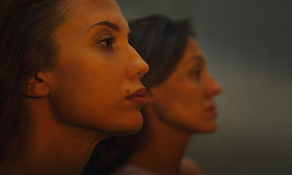Cinematic profile portrait of two young women