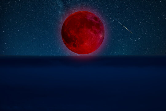 Lunar eclipse on a starry Milky Way background.