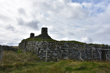 Derelict Stone Dwelling Ruins on Remote Hebridean Moorland Hillside © dejavudesigns