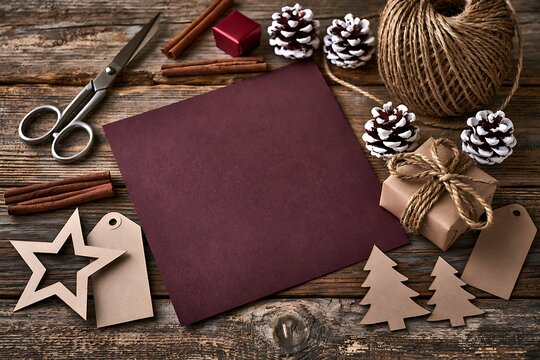 DIY Christmas gift wrapping workplace with blank card mockup and twine
