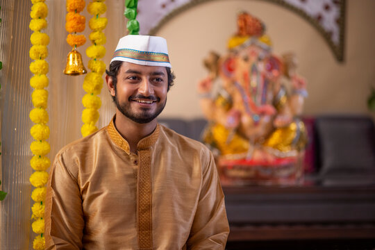 Portrait of a happy Maharashtrian man in traditional outfit on Ganesh Chaturthi festival