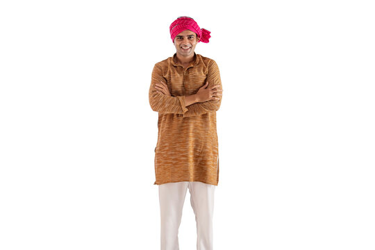Portrait of a farmer standing with arms crossed against white background