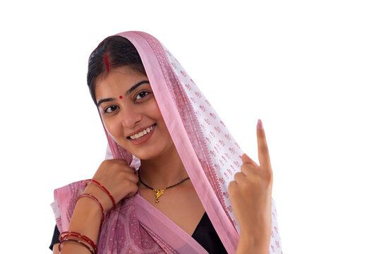 Close-up portrait of a Bihar woman pointing above against white background