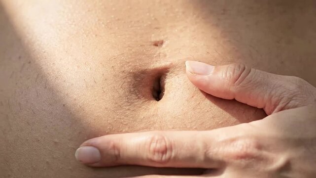 Close-up of Skin Pores and Finger Pressing Extractor